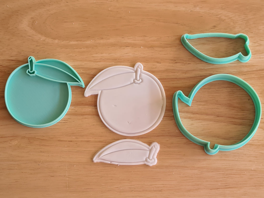 Orange cookie cutter embosser kit